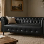 Black button-tufted leather Chesterfield sofa in a living room
